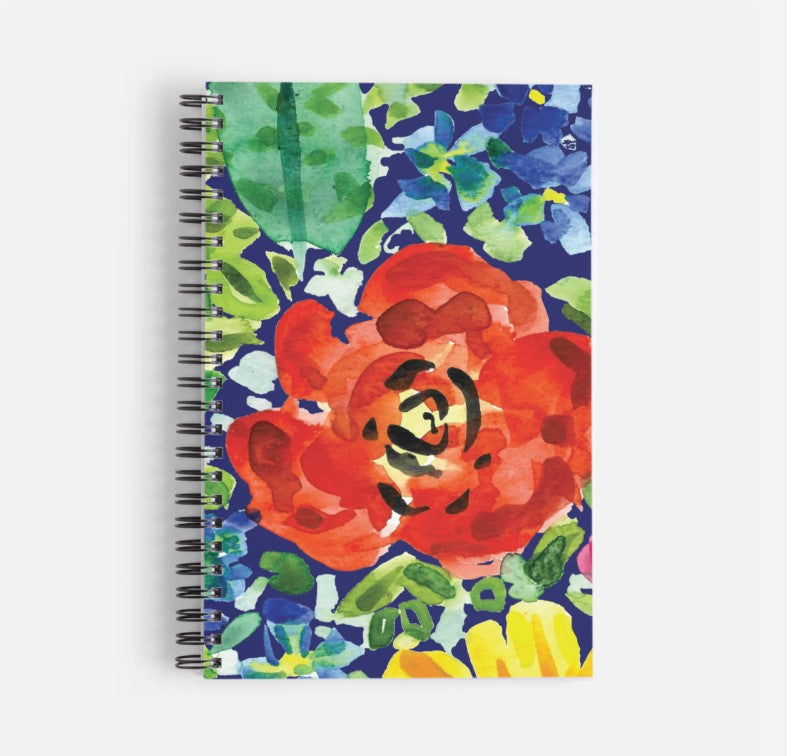 a spiral notebook with a painting of a red flower